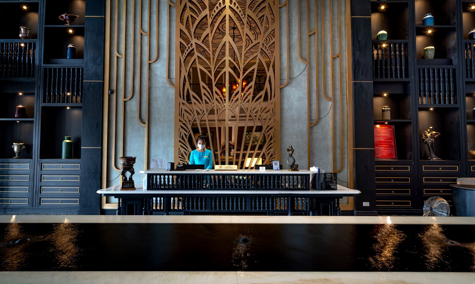 Hotel receptionist working at a front desk